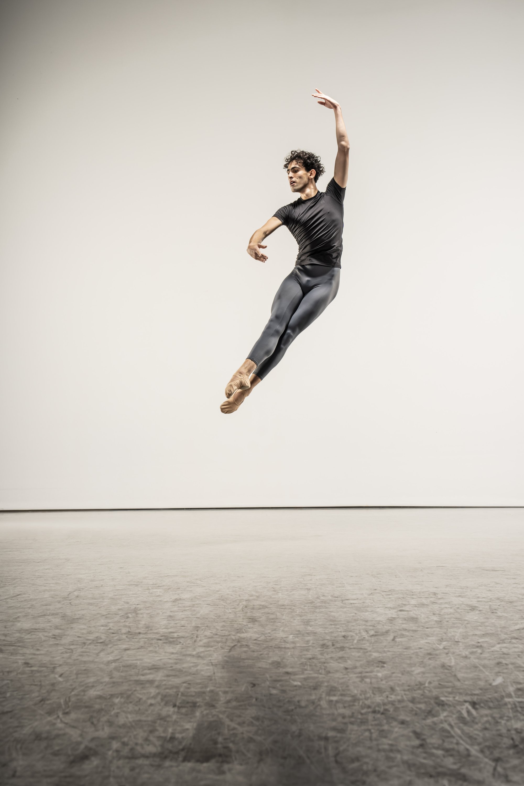 Leo Morad leaping, arm raised